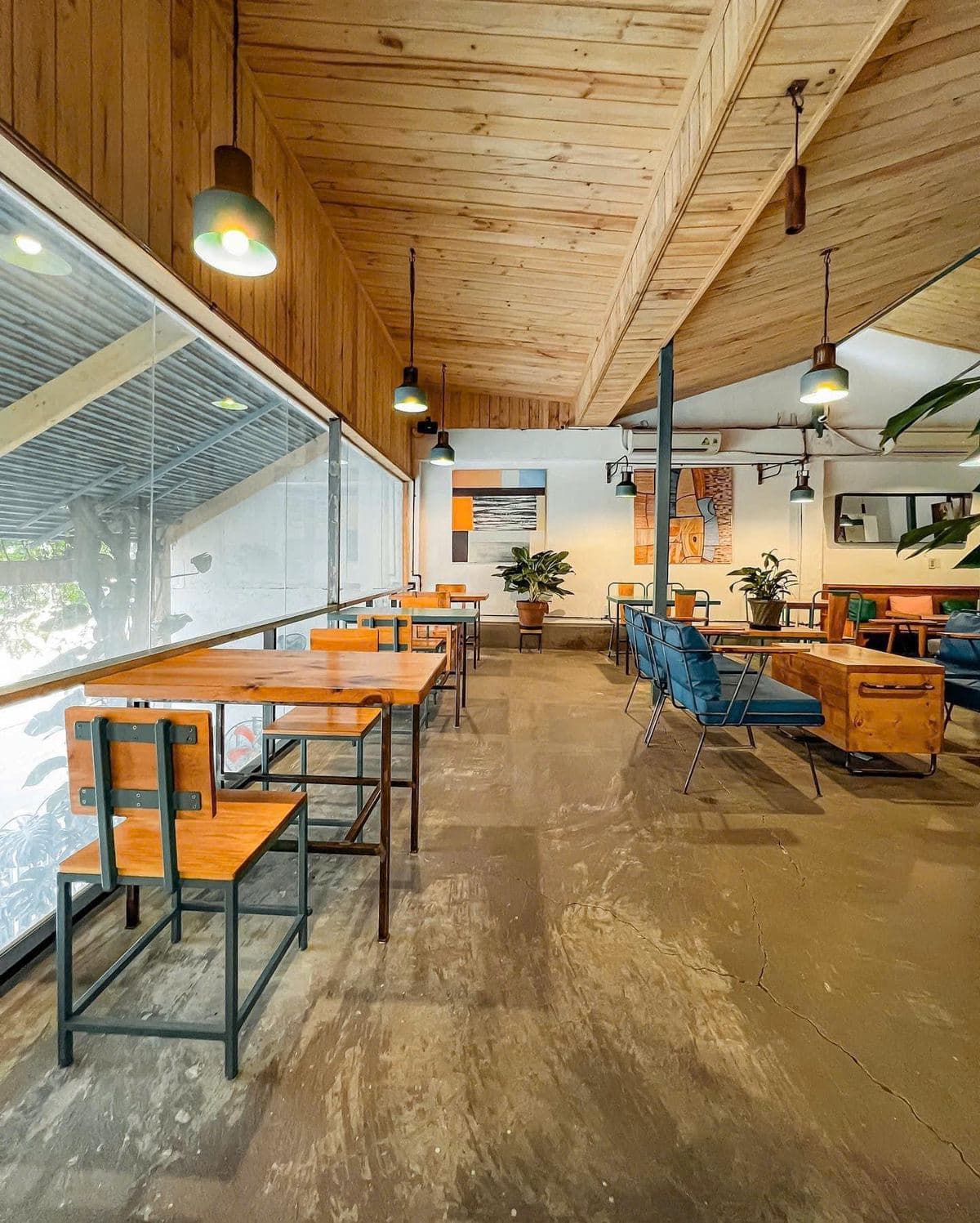 Wooden tables along the café windows