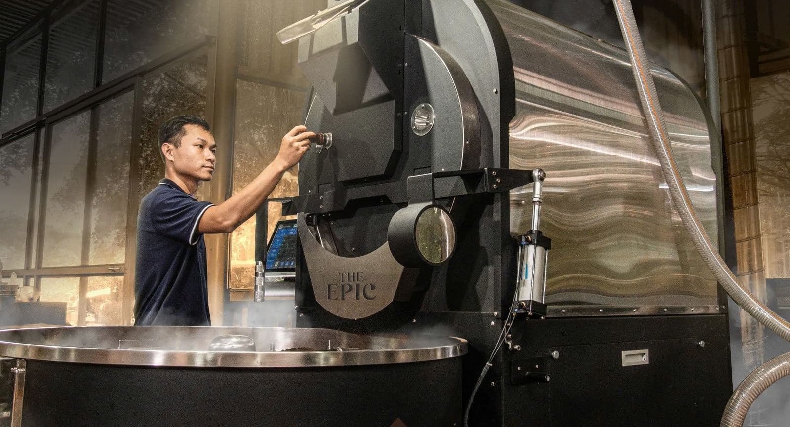 Roaster working the drum at the Epic roastery